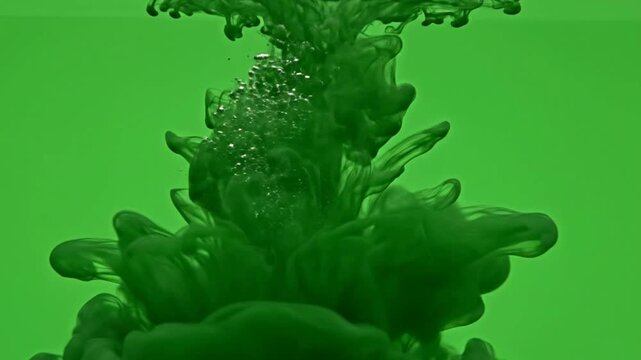 Dark green ink droplet dissolving in water, abstract liquid swirls and bubbles, slow motion fluid motion background, for creative projects