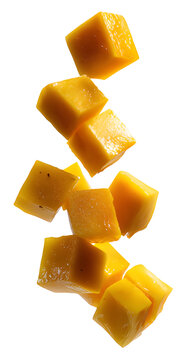 Fresh ripe mango fruit cubes falling down in the air