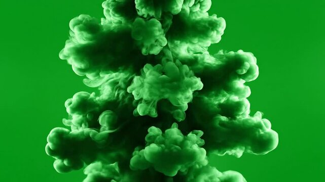 Green smoke explosion isolated on chroma key background, thick cloud burst for visual effects, abstract motion overlay