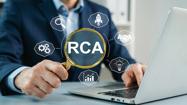 Businessman holding magnifying glass focusing on RCA acronym for root cause analysis business process