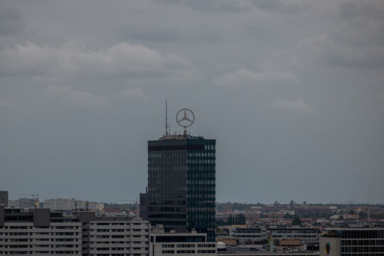 Berlin, Germany - JUly 4, 2026: Mercedes-Benz logo atop an office tower in Berlin, Germany.