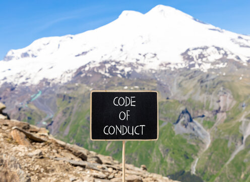 Code of conduct words symbol. Concept words Code of conduct on beautiful black blackboard. Beautiful mountain Elbrus blue sky background. Business Code of conduct concept. Copy space.