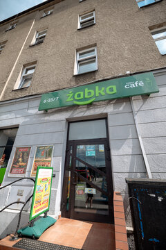 Krakow, Poland - July 19, 2026: Entrance to a Żabka Caf&eacute; convenience store in Poland.