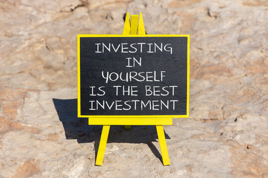 Investing in yourself symbol. Concept words Investing in yourself is the best investment on beautiful black blackboard. Beautiful stone background. Business investing in yourself concept. Copy space