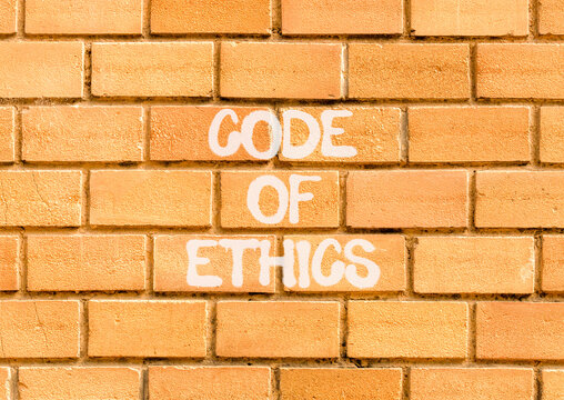 Code of ethics words symbol. Concept words Code of ethics on beautiful brick wall. Beautiful brick wall background. Business Code of ethics concept. Copy space.