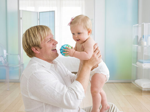 Father playing with baby