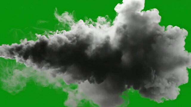 Thick dark smoke cloud bursting on green screen, isolated vfx for motion and compositing explosion chroma key