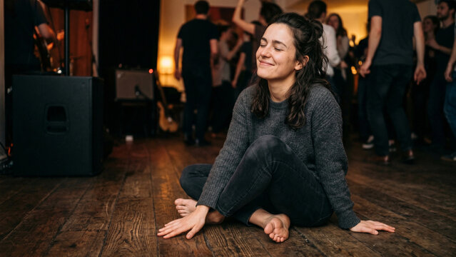 International Day of the Deaf. Photorealistic: young woman smiles, feeling the music vibrate through the floor, her eyes closed in bliss