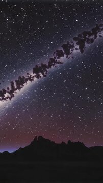 Milky way timelapse over mountains, vertical