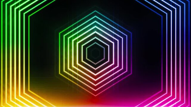 Glowing rainbow neon hexagon tunnel creates a futuristic laser light effect.