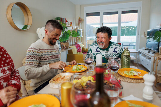 Happy family enjoying christmas dinner celebration together
