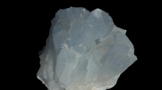 Grey-blue celestine crystals isolated on a black background