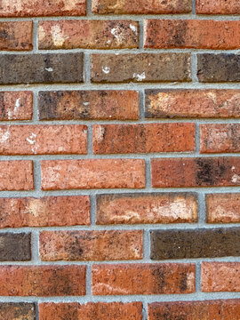 Red Brick Wall Texture With Mortar Joints And Weathered Patina &mdash; Close-Up Masonry Background For Construction Architecture Design And Industrial Surfaces