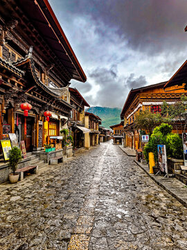 Historic Chinese Village Street with Traditional Wooden Buildings
