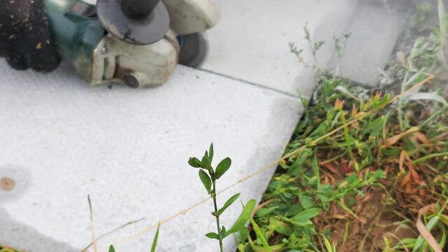 Slab cutting requires angle grinder with protective gloves, removing weeds between concrete tiles. Slab cutting demands careful technique, ensuring precise construction and safe renovation process.