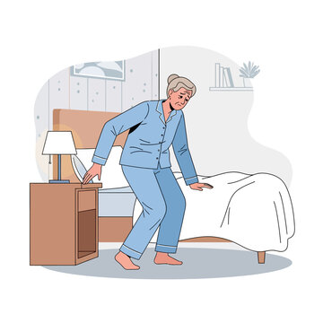 Elderly Woman Waking Up In A Bedroom At Night Feeling Unwell