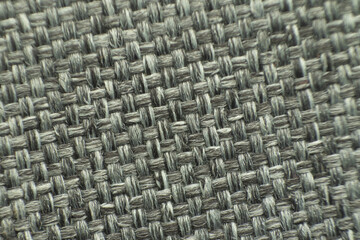Fototapeta premium Close-up of gray woven fabric texture with intricate pattern