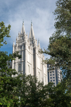 Looking through the trees at the Salt Lake Temple in Salt Lake City Utah on Temple Square.  Headquarters of the Church of Jesus Christ of Latter-Day Saints, also known as LDS Church and the Mormons.