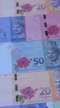 Malaysian ringgit banknotes as a tool for trade and financial transactions. The Malaysian ringgit as a background for your design