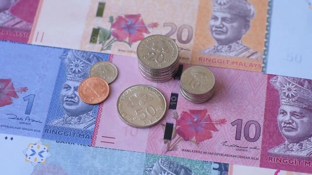 Malaysian ringgit banknotes as a tool for trade and financial transactions. The Malaysian ringgit as a background for your design