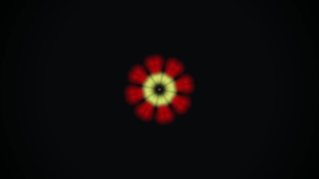 Abstract blurred red and yellow flower pattern light effect on dark black background glowing kaleidoscope pattern design