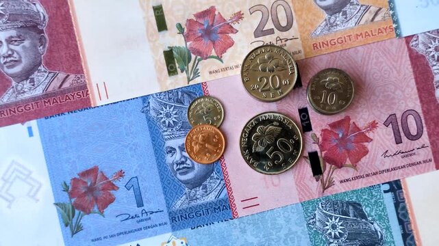 Malaysian ringgit banknotes as a tool for trade and financial transactions. The Malaysian ringgit as a background for your design
