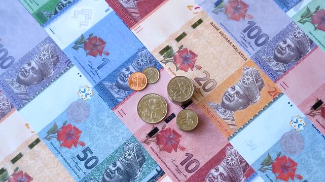 Malaysian ringgit banknotes as a tool for trade and financial transactions. The Malaysian ringgit as a background for your design