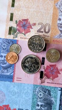 Malaysian ringgit banknotes as a tool for trade and financial transactions. The Malaysian ringgit as a background for your design