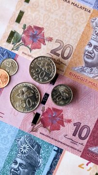 Malaysian ringgit banknotes as a tool for trade and financial transactions. The Malaysian ringgit as a background for your design