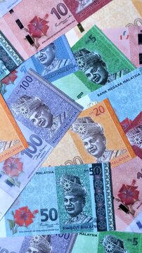 Malaysian ringgit banknotes as a tool for trade and financial transactions. The Malaysian ringgit as a background for your design