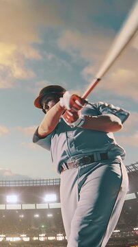 Baseball batter with beard mid-swing follow-through under golden daytime sky