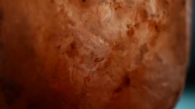 Rock salt background textured copy space illuminated close up, moving light rock salt material