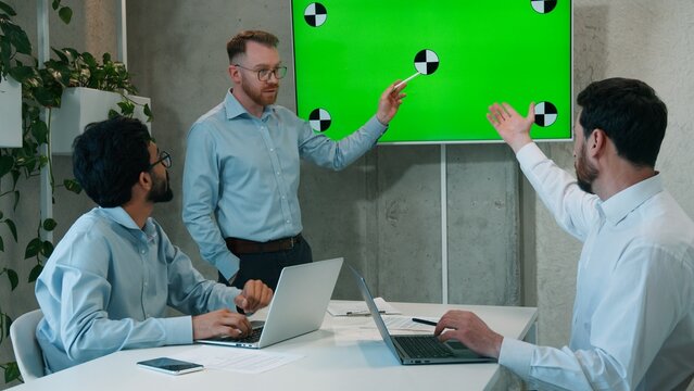 Man CEO talking to multiracial business team presentation at office conference meeting businessmen males workers listening discussing design analysis marketing strategy plan on chroma key green screen