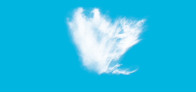 Single white fluffy cloud isolated against a bright blue sky background.