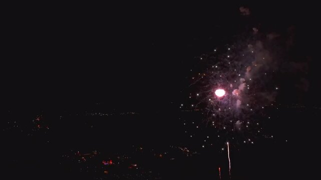 View of colorful fireworks display lighting up the night sky over the town Paradise, Pennsylvania, United States.