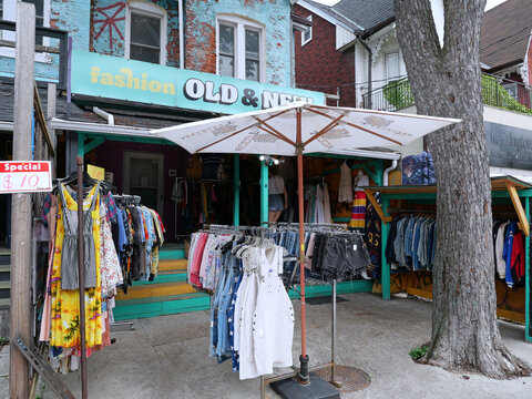 Vintage clothing store with outdoor display on sidewalk, Kensington Market bazaar, Toronto