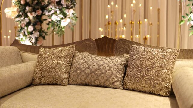 Decorated chairs with cushions on a wedding