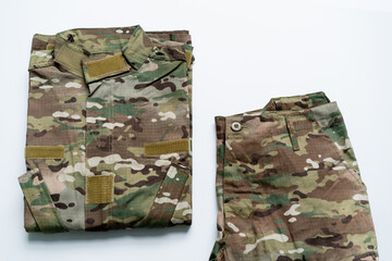 Fototapeta premium A folded camo military uniform and pants symbolize Ukraines resilience on Independence Day.