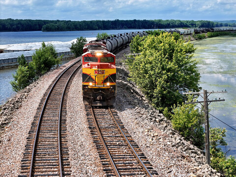 Savanna, Illinois June 24, 2026 Kansas City Southern 4112 SD70ACe Locomotive pulling mixed freight along the Mississippi river