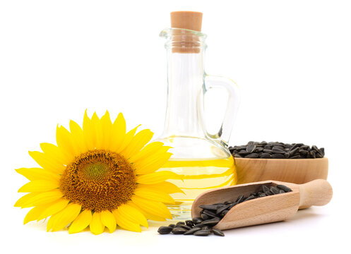 Sunflower Oil in Glass Bottle with Flower and Seeds