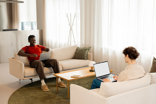 Business laptop mockup in collaborative workplace setting