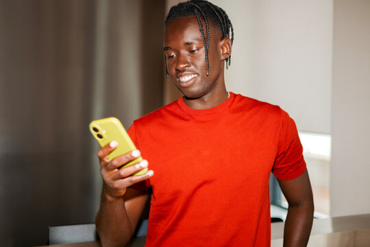 Man using smartphone in modern office interior