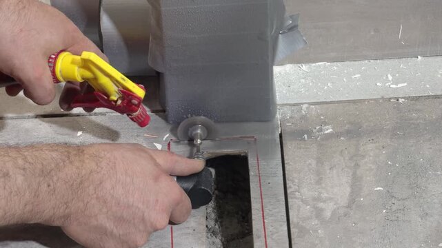 Cutting a square opening in ceramic tile with a small angle grinder and water