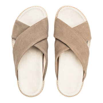 Top view of beige suede crossover slide sandals isolated on white background
