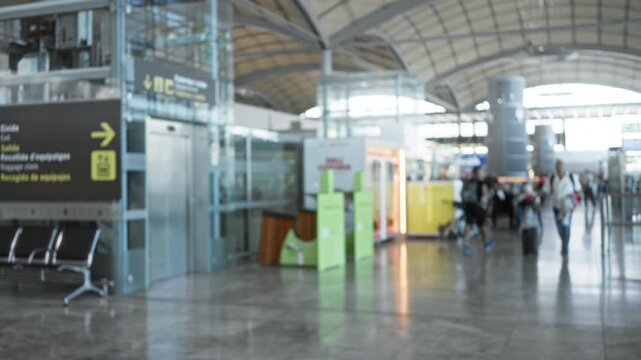 Airport terminal blurred bokeh interior with soft defocused architecture and reflective floor; background copyspace template.