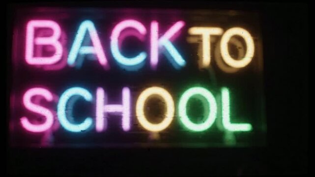 Back to school neon sign with digital glitch effect and data corruption overlay for education and academic marketing campaigns