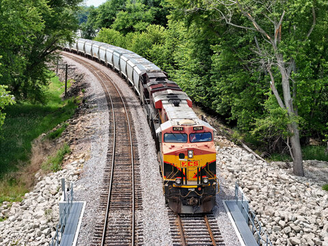 Savanna, Illinois June 23, 2026 Kansas City Southern locomotive 4794, leads a freight train through a lush, tree‑lined corridor on a double‑track mainline.