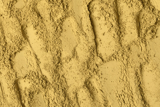Fine hojicha tea powder forms warm golden swirls and serves as earthy Japanese texture for drinks, desserts, wellness, and design.