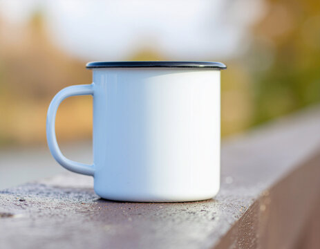 A plain white ceramic mug sits on a concrete windowsill illuminated by soft morning daylight, creating a calm minimalist lifestyle scene with generous copy space