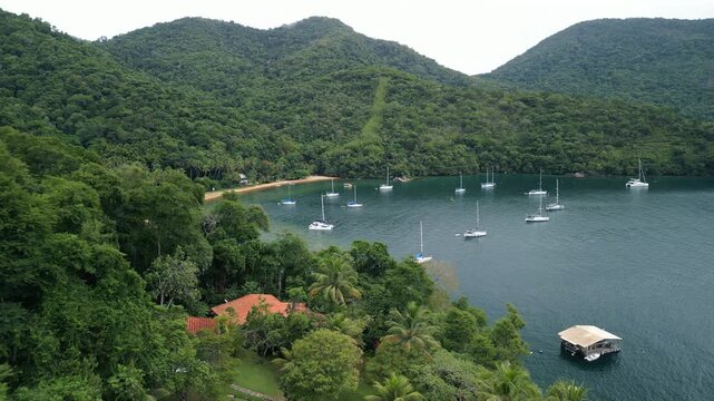 Boats anchored in a calm bay. Ilha Grande, Brazil